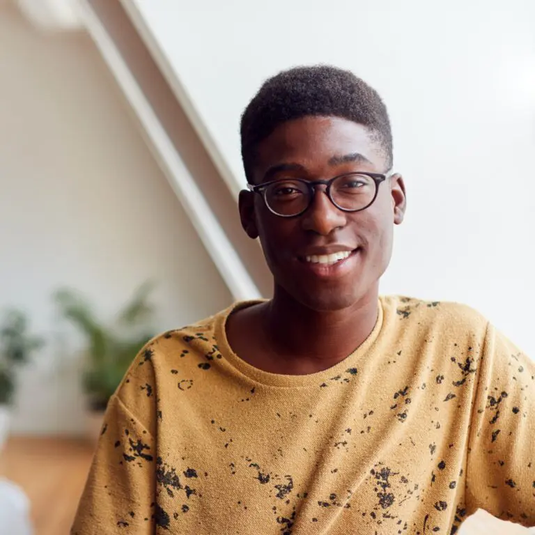 portrait-of-smiling-young-man-in-loft-apartment-76